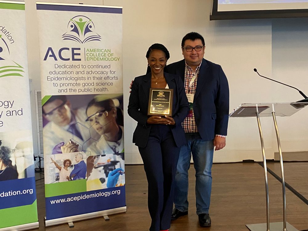 The Endowed Lecture Award Recipient smiles wide when presented with her award