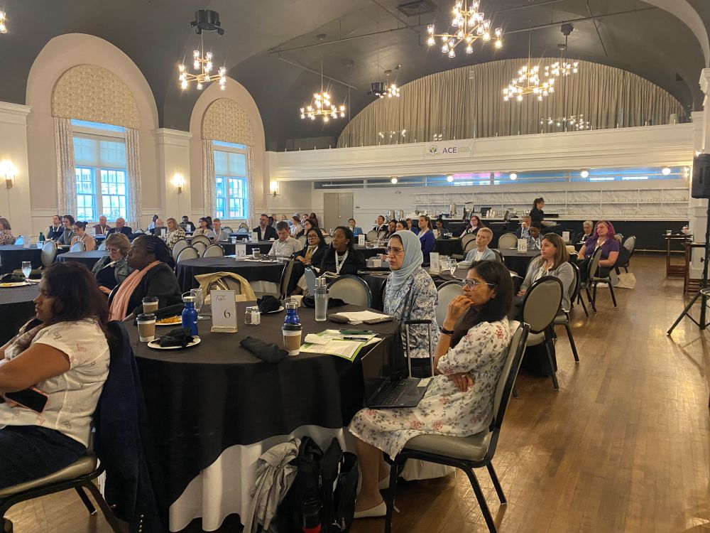 A large crowd sits at round tables during th group sessions at the ACE Annual Meeting