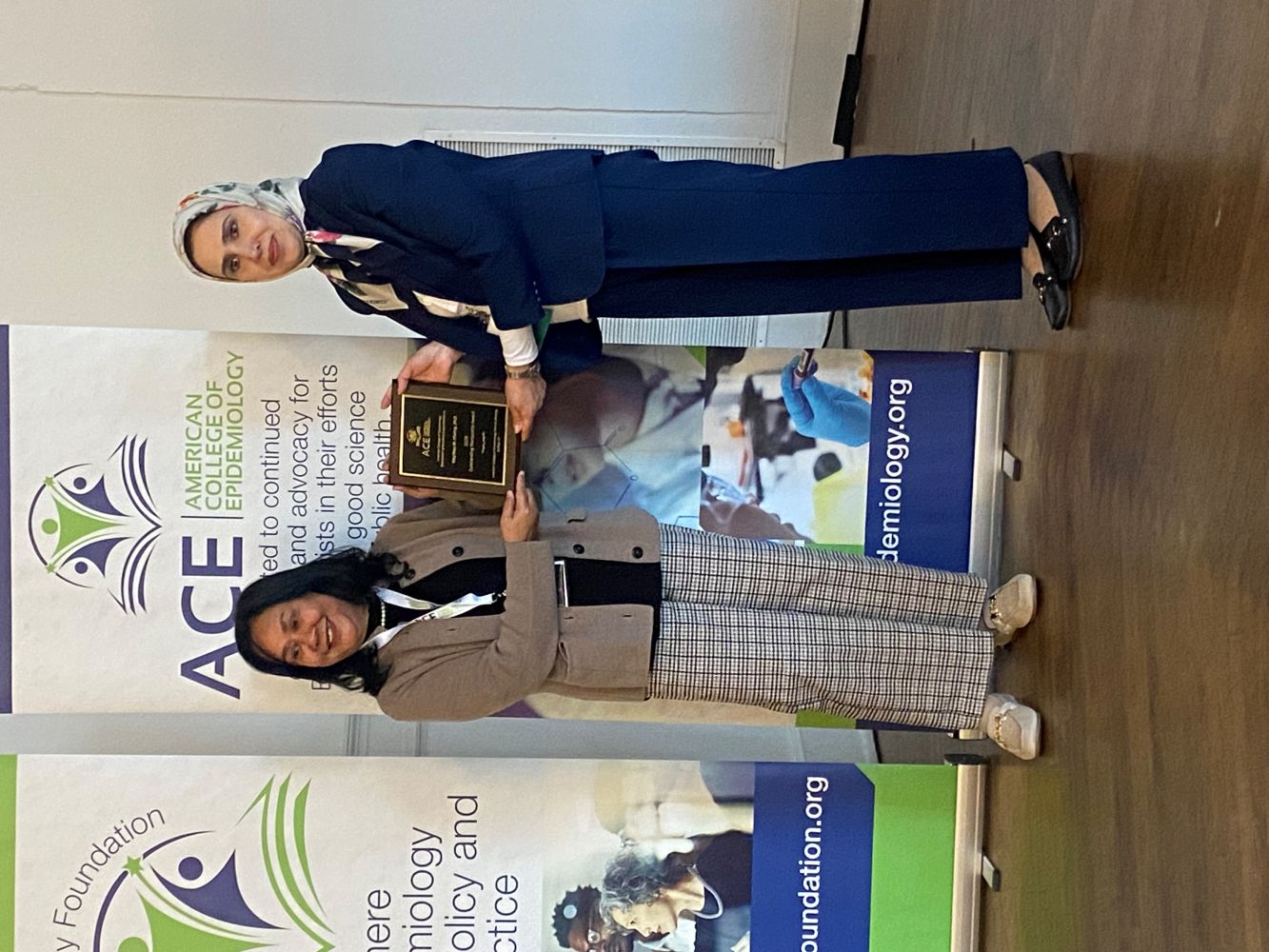 THe Outstanding Mentorship Award recipient receives her plaque